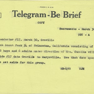 May include: A yellow telegram form with the text "Telegram-Be Brief" and "Safety First" in the top right corner. The text reads "Conductor #17, March 30, Oroville Cub Scout Pack 34 of Princeton, California consisting of 18 boys and 6 adults under direction of Mrs. Cummins will ride #17 date Oroville to Marysville. See that dome space is set aside for this group. MB-490 EJH".