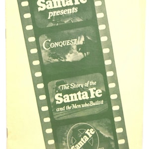 May include: A green and white film strip with the text "Santa Fe presents Conquest" and "The Story of the Santa Fe and the Men who Builtit". The bottom of the strip has a green circle with the text "Santa Fe DEDICATED TO SERVICE".