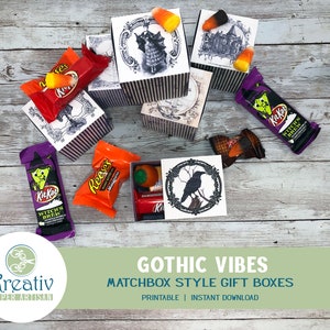 May include: Printable Halloween-themed matchbox style gift boxes with gothic designs. The boxes are decorated with black and white illustrations of a witch, a haunted house, and a raven. The boxes are filled with candy, including Kit Kat, Reese's, and candy corn.