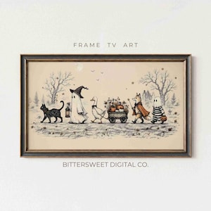Peut inclure: Une impression d'art numérique encadrée rectangulaire intitulée FRAME TV ART par BITTERSWEET DIGITAL CO. L'illustration montre un chat noir, un fantôme avec un chapeau de sorcière, un canard tirant un chariot de citrouilles, un renard et un fantôme en pantalon rayé.