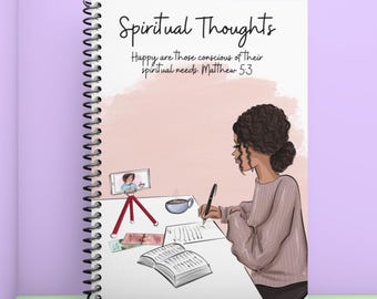 May include: Spiral-bound notebook with the text "Spiritual Thoughts" and a quote from Matthew 5:3. The cover features an illustration of a person writing at a desk with a phone on a tripod and a cup of coffee.