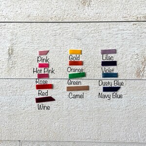 May include: A collection of fabric swatches in various colors, including pink, hot pink, rose, red, wine, gold, orange, lilac, violet, green, dusty blue, camel, and navy blue.