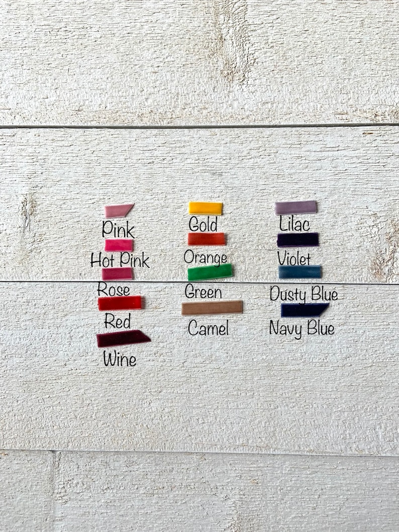 May include: A collection of fabric swatches in various colors, including pink, hot pink, rose, red, wine, gold, orange, lilac, violet, green, dusty blue, camel, and navy blue.