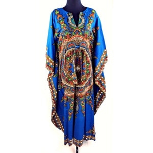 May include: A blue kaftan with a colorful, intricate pattern. The kaftan has a V-neck and a tie at the waist.