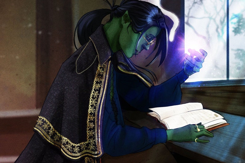 May include: A green-skinned person with long black hair, wearing glasses, a dark blue shirt, and a black cape with gold embroidery, is reading a book while holding a glowing orb in their hand. The person is sitting at a table next to a window.