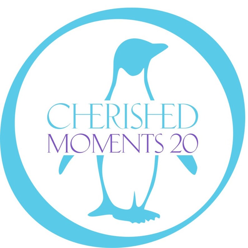 May include: A blue penguin silhouette inside a light blue circle with the text "CHERISHED MOMENTS 20" in purple.