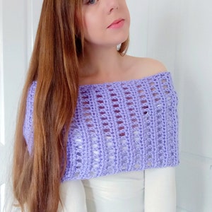 May include: A lavender crochet off-the-shoulder top with a lacy pattern.