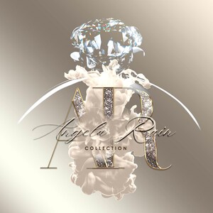 May include: A gold and silver logo with the letters "AR" inside a white cloud-like shape. The letters are surrounded by glitter and a large diamond sits above the cloud. The text "Angela Rain Collection" is below the cloud.