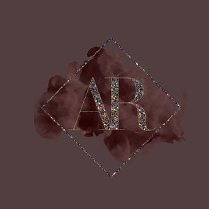 May include: A gold diamond frame with a glittery gold "AR" monogram on a dark red watercolor background.