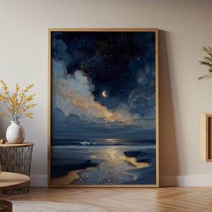 May include: A framed vertical wall art print depicting a night seascape with a crescent moon, a starry dark blue sky, and voluminous clouds. The scene features a reflective shoreline with golden sand and dark blue water under a moonlit horizon.