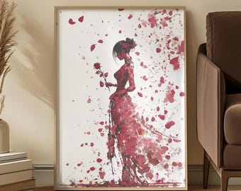 May include: A framed art print depicting a watercolour illustration of a woman in a red dress holding a rose. The artwork has a flowing, ethereal quality with scattered red petals against a white background. The frame is a light brown colour.