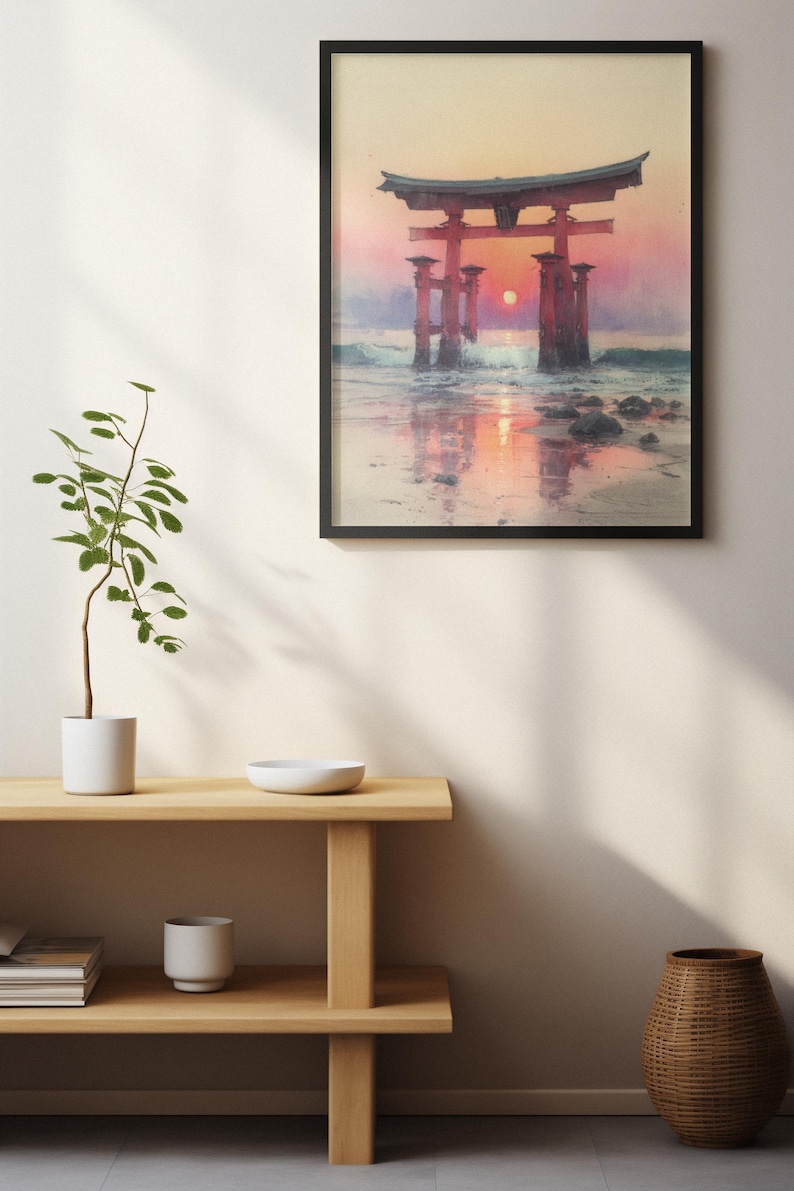 May include: Framed art print of a Japanese torii gate at sunset. The red gate stands in the water, with the sun setting behind it, creating a vibrant orange and pink sky. The print is in a black frame.