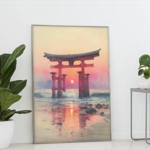 May include: Framed print of a Japanese torii gate at sunset. The artwork features a vibrant color palette of red, orange, and purple, with the gate reflected in the water. The print is displayed in a silver frame.