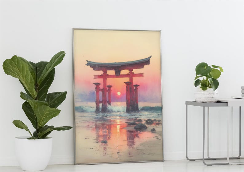 May include: Framed print of a Japanese torii gate at sunset. The artwork features a vibrant color palette of red, orange, and purple, with the gate reflected in the water. The print is displayed in a silver frame.