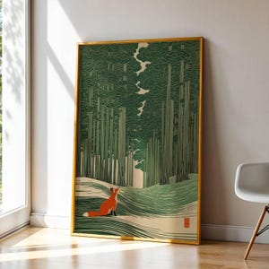 May include: A framed art print featuring a stylised illustration of a small orange fox sitting in a forest of tall, dark green trees. The ground is depicted with flowing, wavy lines in shades of green and cream, and a small red seal is in the corner.