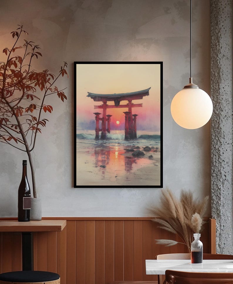 May include: Framed art print of a Japanese torii gate at sunset. The artwork depicts the gate in the ocean with the sun setting between the pillars, reflecting on the water. The sky transitions from orange to pink.