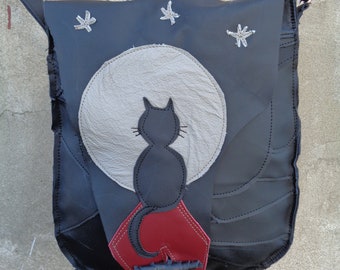Artistic black leather bag with a moon and a cat. Handmade