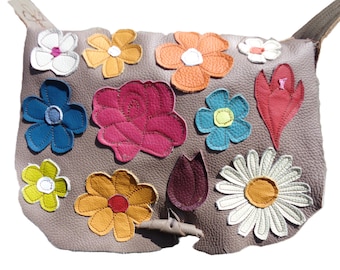 Artistic leather handbag with flowers. Handmade