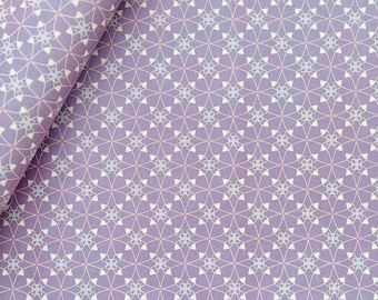 May include: A lavender fabric featuring a repeating geometric pattern of white interlocking curved lines and small light blue four-pointed star shapes, accented by tiny pink dots at the center of each intersection throughout the design.