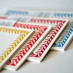 Dix cartes vierges avec bordure à motifs