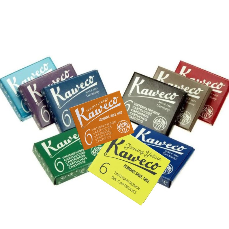 May include: A collection of Kaweco ink cartridge boxes in various colors, including blue, purple, orange, green, and yellow. Each box displays the Kaweco logo and the text "Germany Since 1883". The boxes contain 6 ink cartridges.