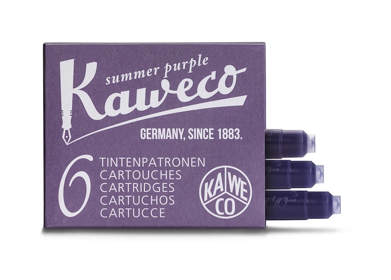 May include: A box of Kaweco summer purple ink cartridges. The box is a deep purple color and features the Kaweco logo and text in white. The box contains six ink cartridges, with three visible. The text on the box includes "Germany, Since 1883."