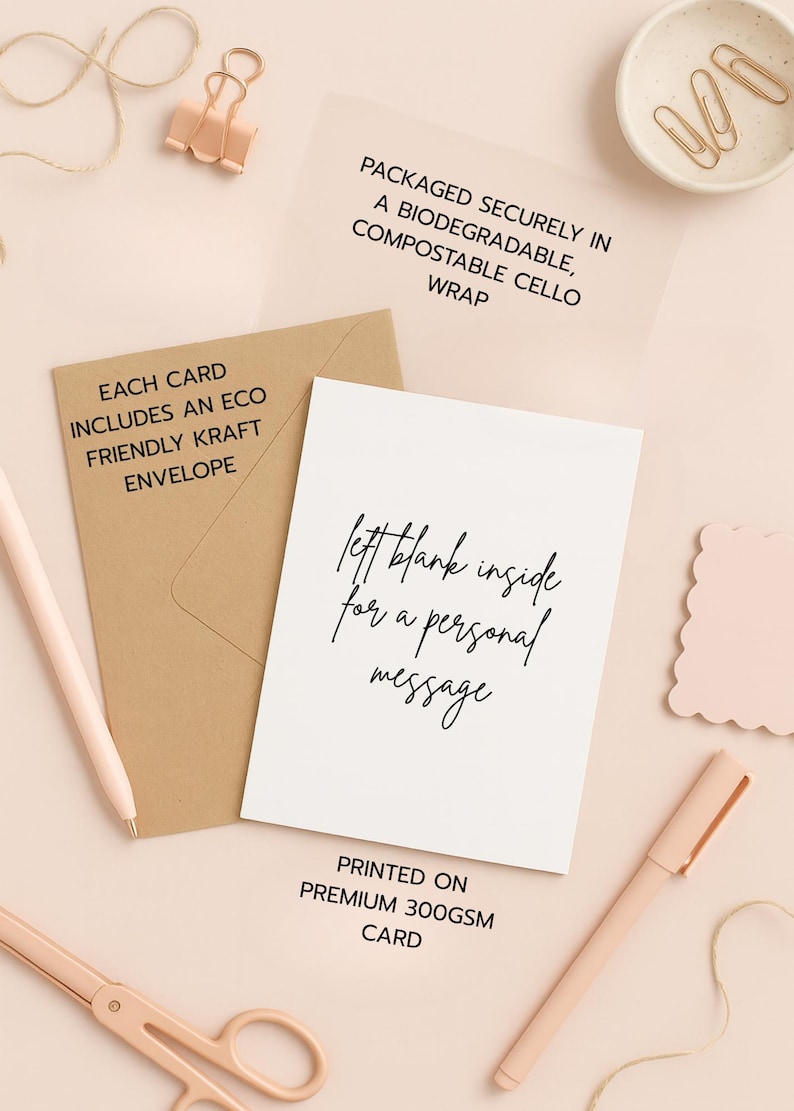 May include: A stationery flat lay featuring a white card with the text "left blank inside for a personal message", a kraft envelope, and a pen. The card is printed on premium 300gsm card. Other items include a paper clip, and a pair of scissors.