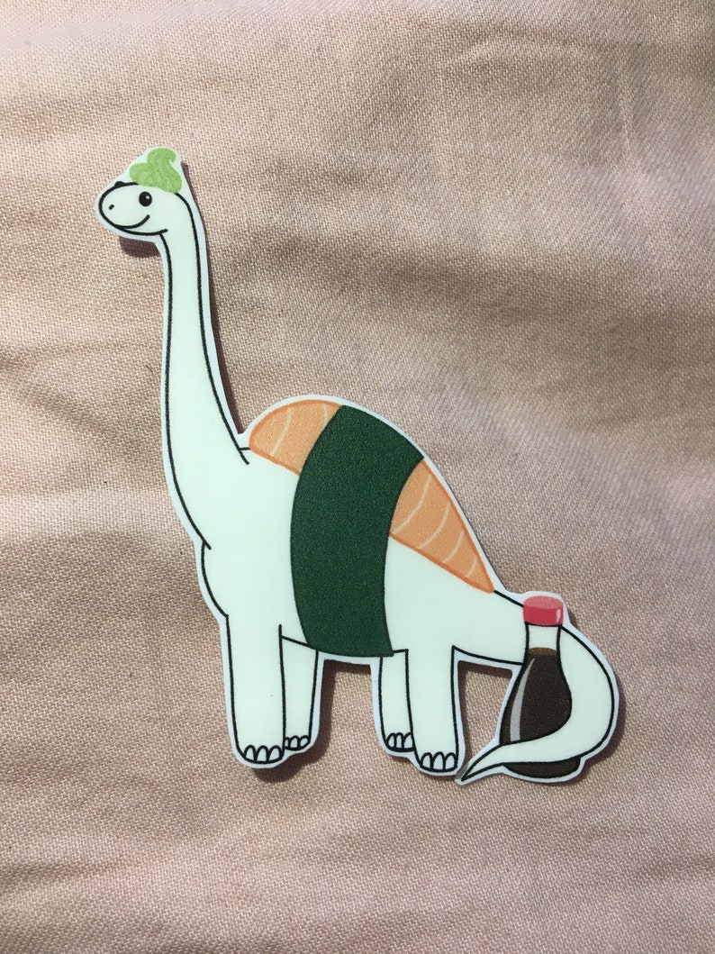 May include: A white cartoon dinosaur with a green seaweed hat and a sushi roll body. The dinosaur's tail is a bottle of soy sauce.