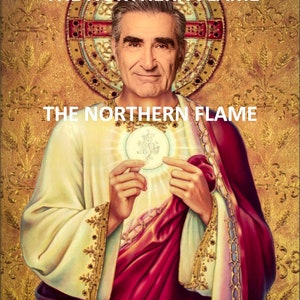 May include: A digital art image of a man with a white beard and mustache, wearing a white and red robe, holding a golden disc with a white symbol in the center. The image is set against a gold background with a gold and red halo behind the man's head. The text "THE NORTHERN FLAME" appears twice in the image.