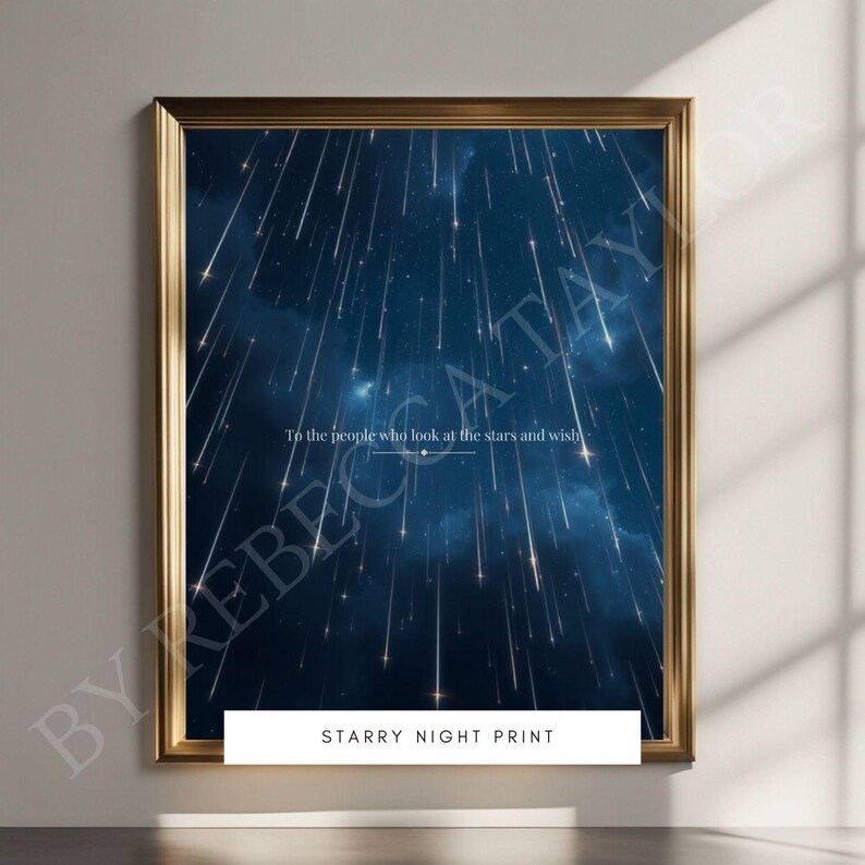 May include: A gold framed print with a dark blue background and white shooting stars. The print has the text "To the people who look at the stars and wish" and "Starry Night Print" at the bottom.