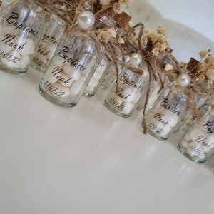 Sugared almonds, guest gift in glass vial