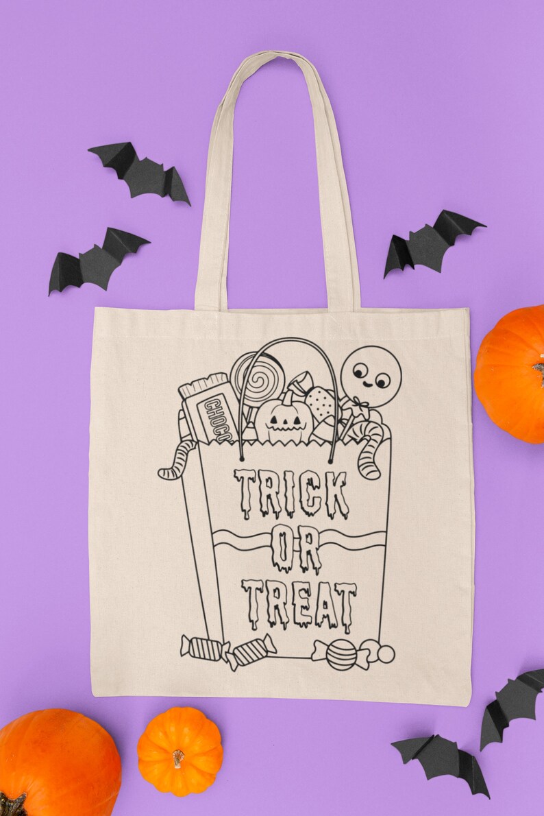 May include: A white canvas tote bag with black outlines of a trick or treat bag filled with sweets, a pumpkin, and a worm. The text "Trick or Treat" is written on the bag. The bag is surrounded by black paper bats and orange pumpkins on a purple background.