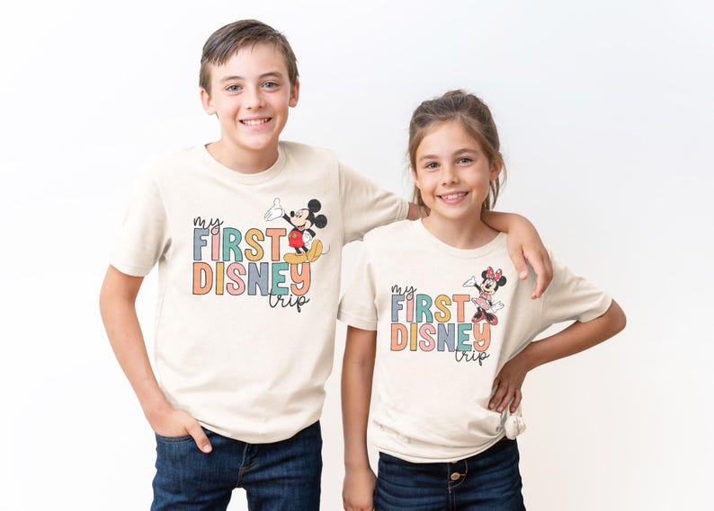 a couple of kids standing next to each other