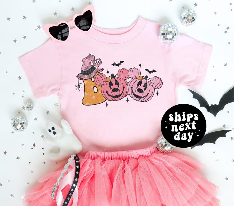 a pink shirt and pink tutu skirt on a white background