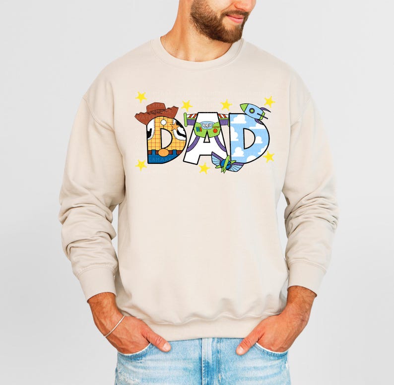 a man wearing a sweatshirt with the word dad printed on it