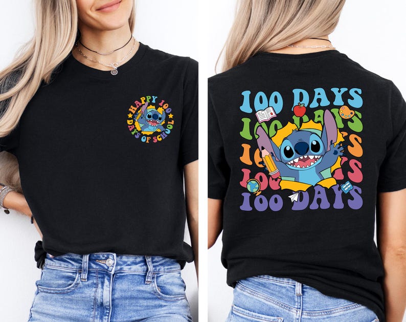 A woman wearing a black t-shirt with a colorful graphic design featuring a cartoon character and text related to the 100 Days of School.