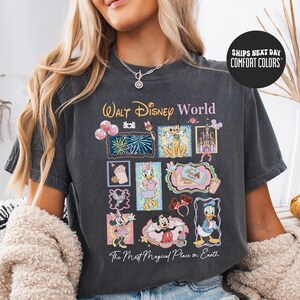 A woman wearing a black t-shirt with a Disney World-themed graphic design, including various Disney characters and elements.