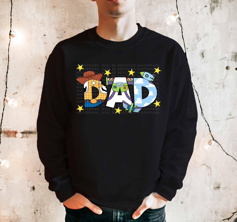 a man wearing a black sweatshirt with the word dad printed on it