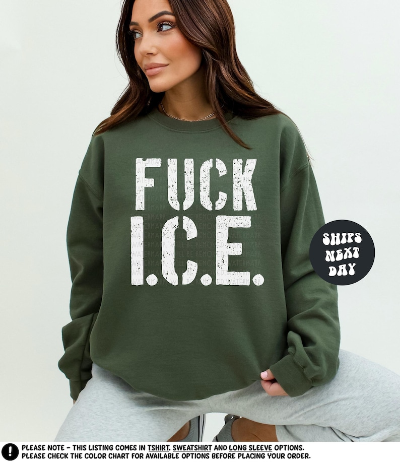 a woman wearing a sweatshirt that says fuck ice
