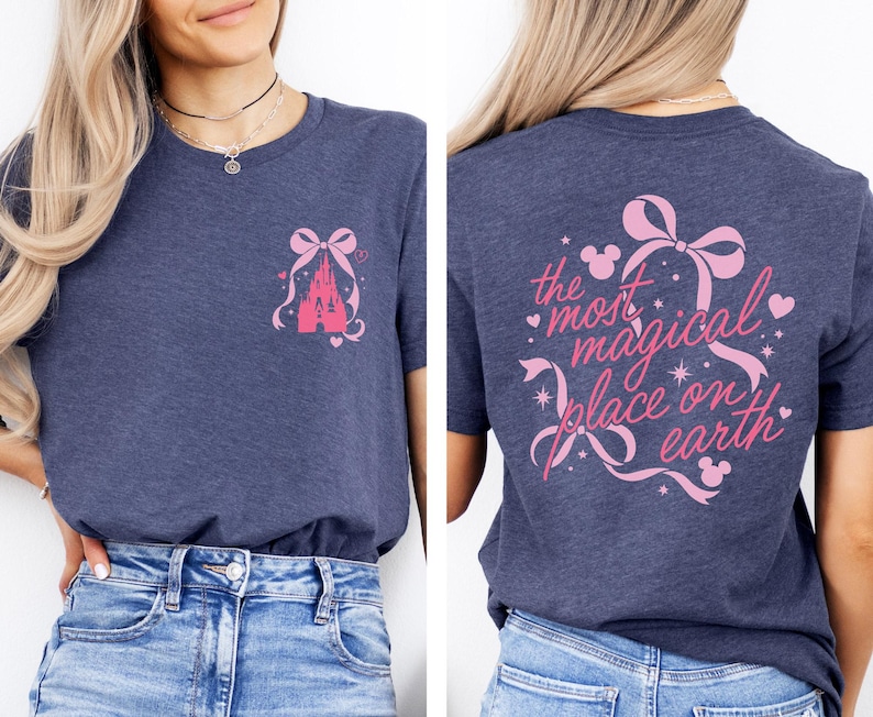 a woman wearing a gray t-shirt with a pink castle graphic and text on the back.