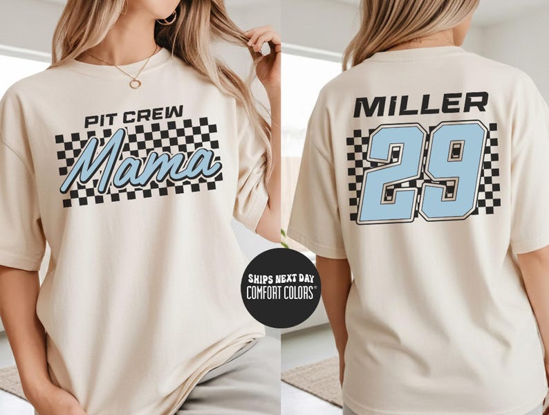 A woman wearing a white t-shirt with a checkered pattern and text, and the number 29 on the back.