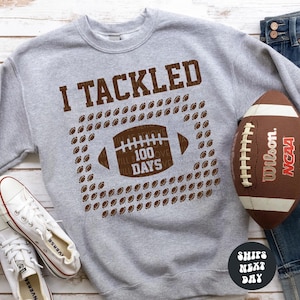 a football and a pair of jeans on a table