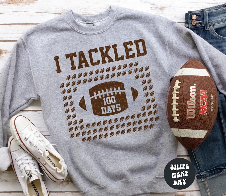 a football and a pair of jeans on a table