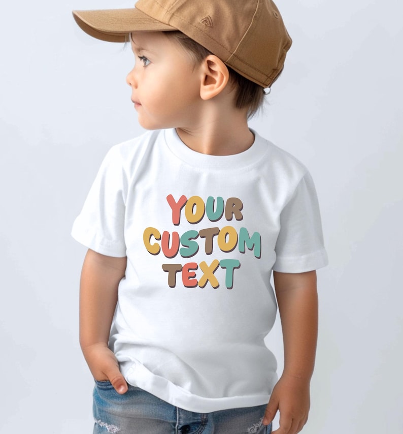 a little boy wearing a white shirt and a brown hat