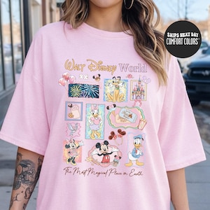A woman wearing a pink t-shirt with Disney World graphics and text.