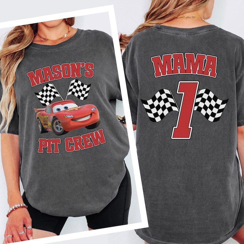 A gray t-shirt with a graphic of a red car and checkered flags, along with the text "MASON'S PIT CREW" and the number "1" on the back.