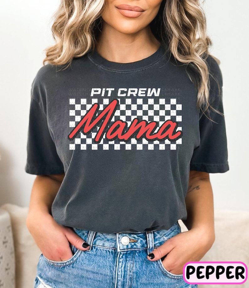 a woman wearing a black t - shirt with a checkered design