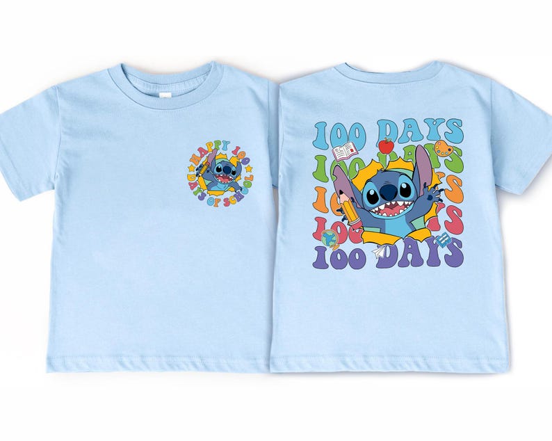 A light blue t-shirt with a colorful graphic design featuring a cartoon character and the text "100 DAYS" in a playful, celebratory style.