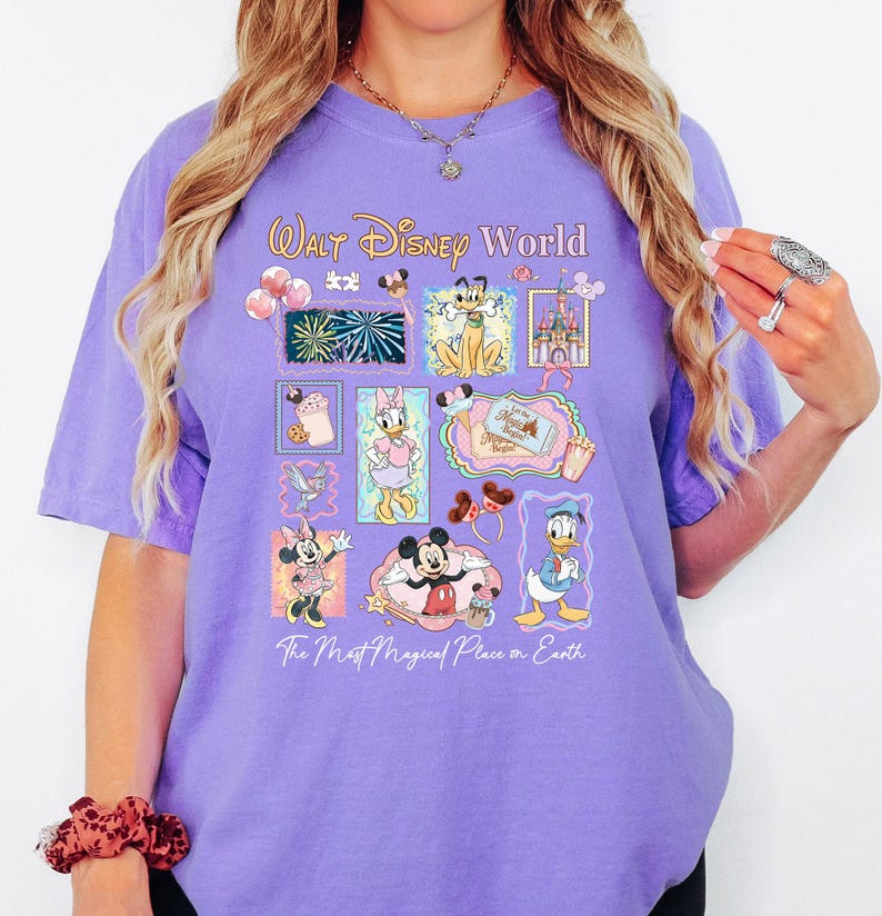 A woman wearing a purple t-shirt with Disney characters and text, including Mickey Mouse, Minnie Mouse, Donald Duck, and other Disney characters.