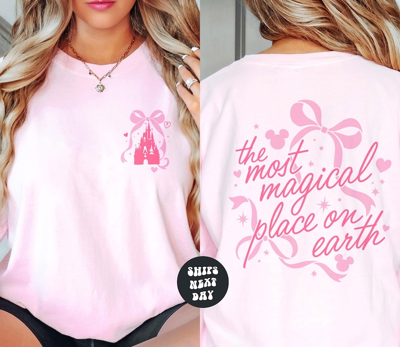 A woman wearing a pink t-shirt with a Disney castle design and the text "the most magical place on earth" printed on the back.